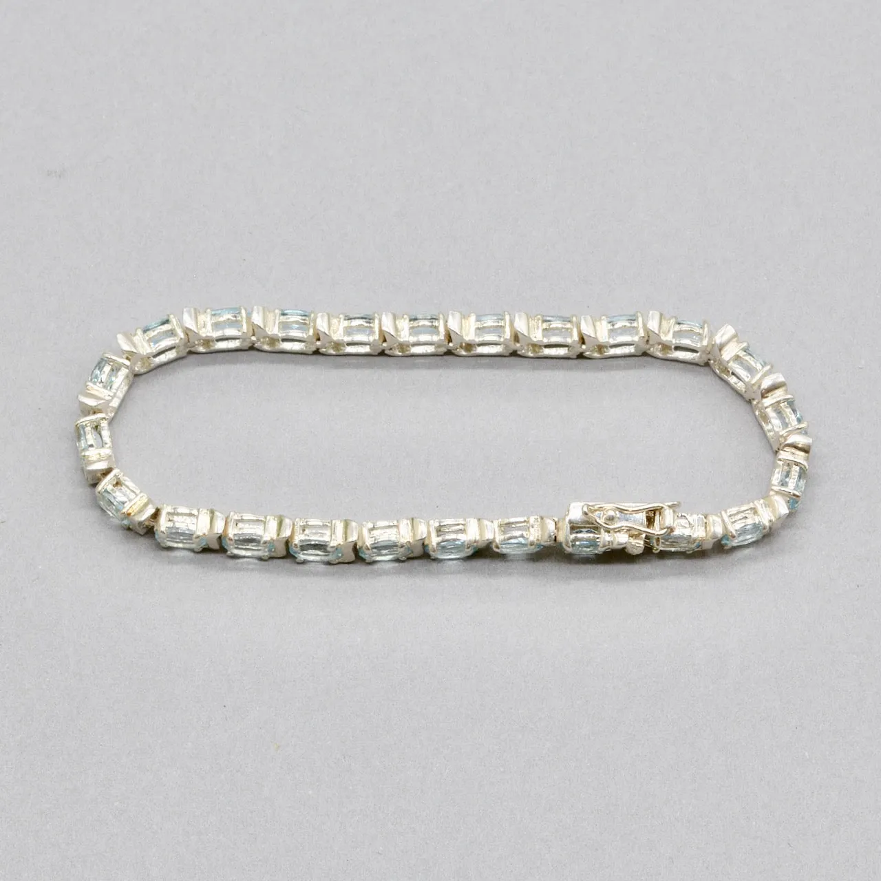 Sky Blue Topaz Tennis Bracelet in Sterling Silver UK Hallmarked (12 carats)