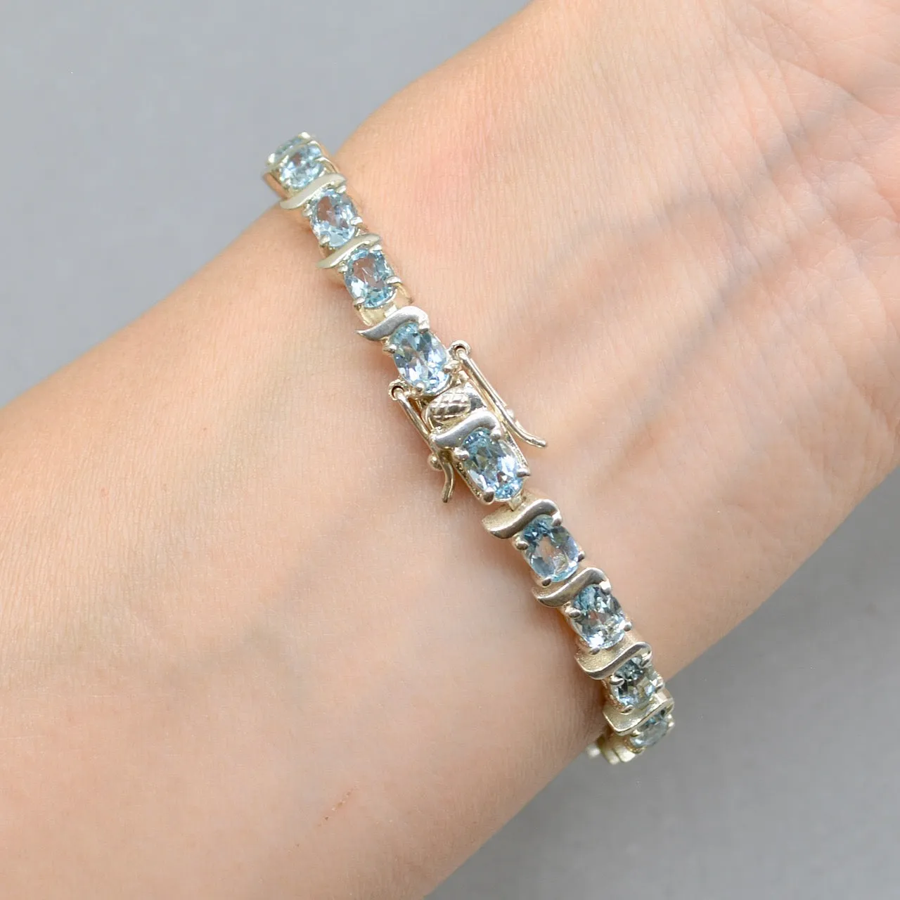 Sky Blue Topaz Tennis Bracelet in Sterling Silver UK Hallmarked (12 carats)